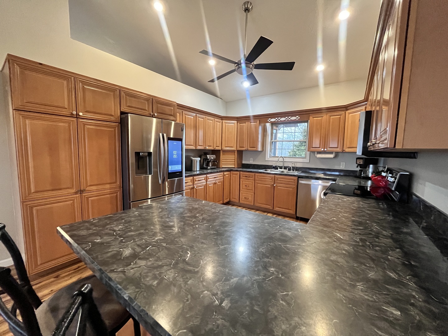 5488 Tick Ridge Road Grand Chain, IL 62941 - Photo 24 of 47 a kitchen with stainless steel appliances granite countertop a sink window and cabinets