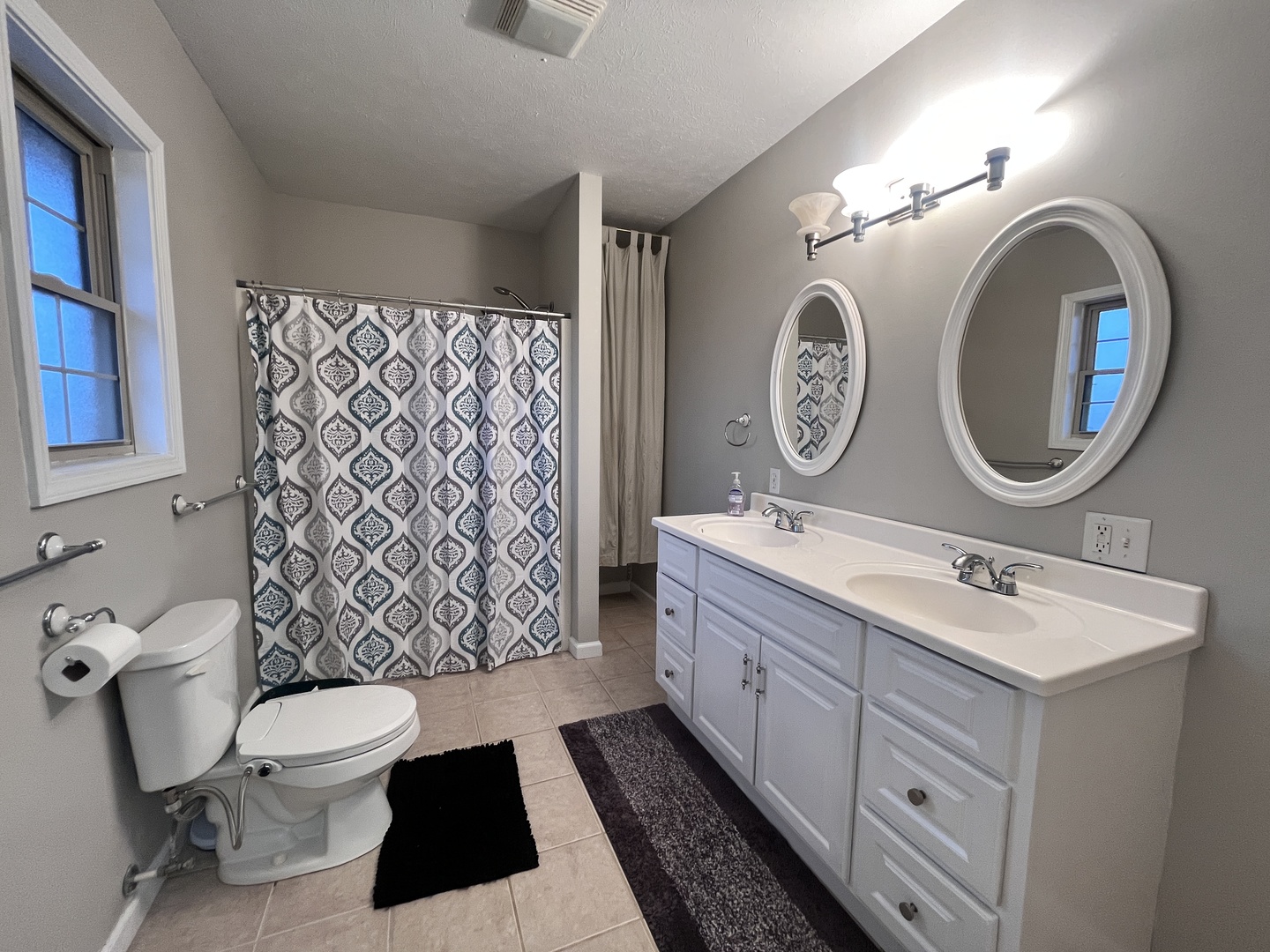 5488 Tick Ridge Road Grand Chain, IL 62941 - Photo 30 of 47 a bathroom with a toilet a sink and a mirror