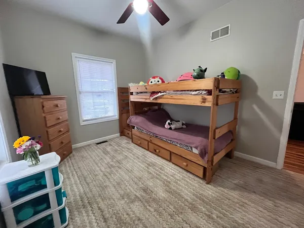 a room with furniture and a flat screen tv