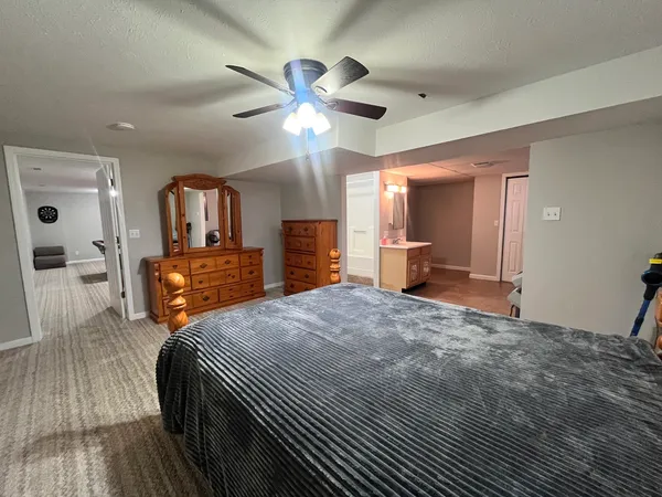 a bed room with a bed and furniture