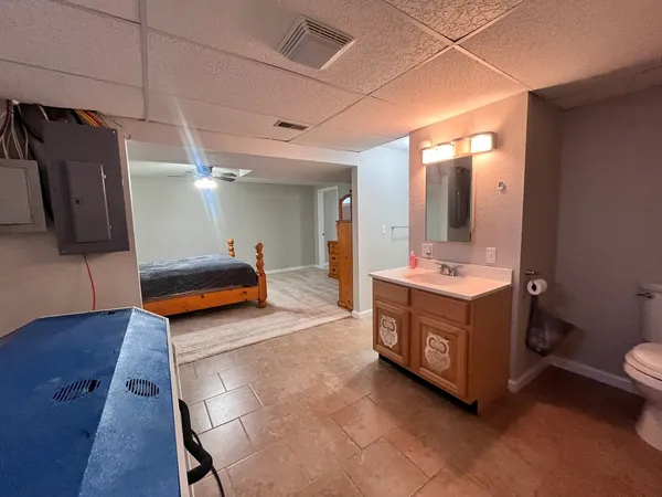a bathroom with double vanity sink and mirror