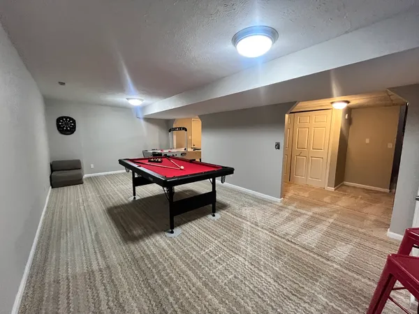 a bedroom with furniture and a wooden floor