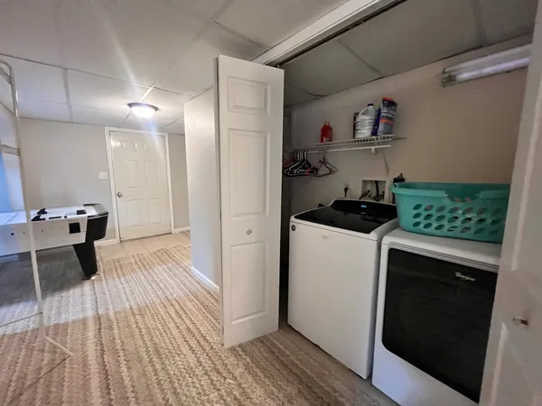 a kitchen with a sink and wooden floor