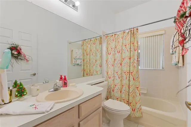 a view of a house with backyard and porch