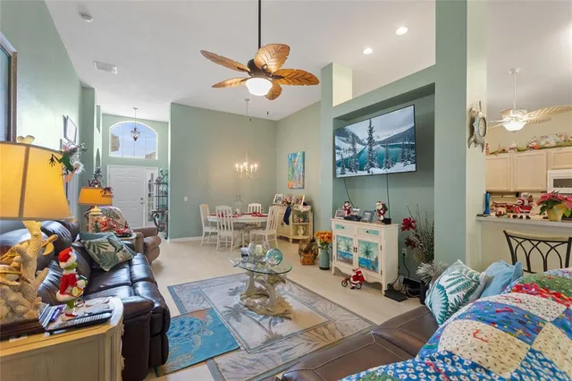 a kitchen with stainless steel appliances kitchen island granite countertop a refrigerator and microwave