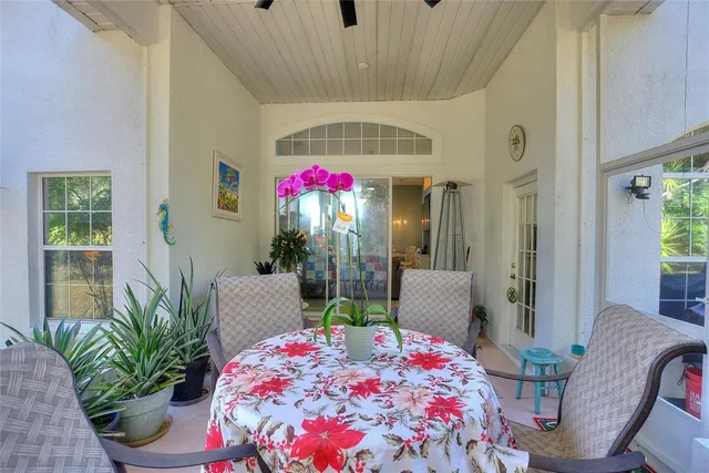 a dining room with furniture and a chandelier