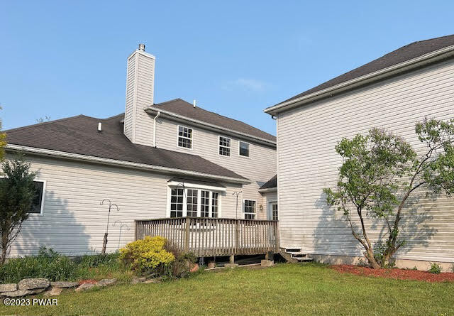 382 Roemerville Road Newfoundland, PA 18445 - Photo 25 of 25 a front view of a house with a garden and plants