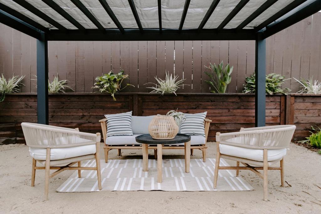 1027 San Abella Drive Encinitas, CA 92024 - Photo 11 of 27 a view of a chairs and table in a patio
