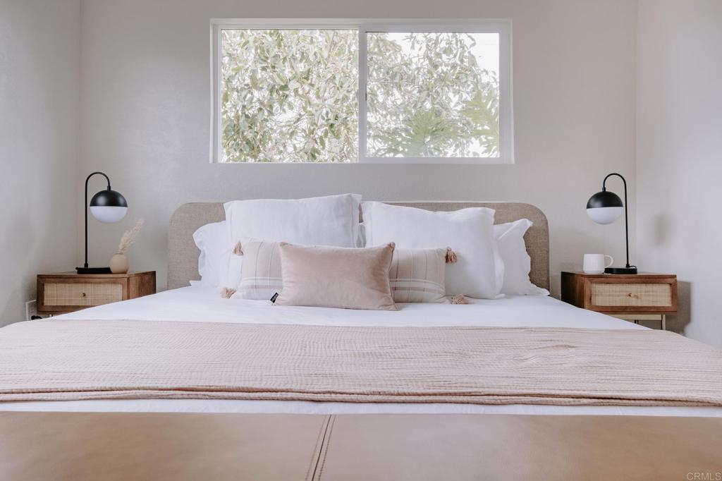 1027 San Abella Drive Encinitas, CA 92024 - Photo 13 of 27 a large white bed in a small room
