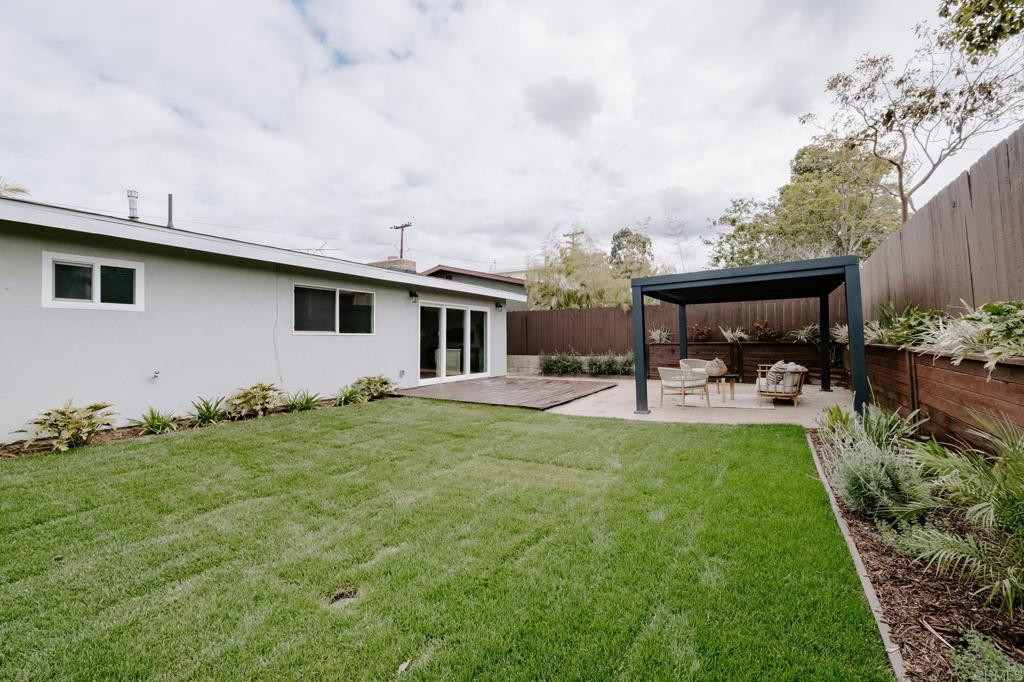 1027 San Abella Drive Encinitas, CA 92024 - Photo 22 of 27 a view of a house with backyard and sitting area