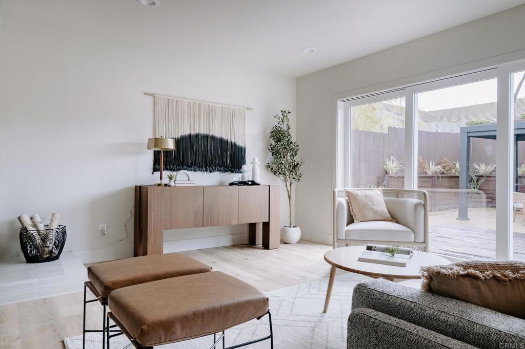1027 San Abella Drive Encinitas, CA 92024 - Photo 8 of 27 a living room with furniture and a flat screen tv
