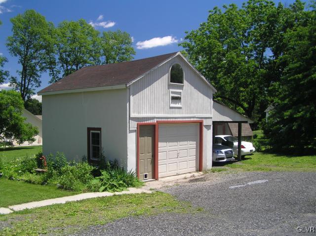 5810 Locust Valley Road Coopersburg, PA 18036 - Photo 22 of 23 a front view of a house with a yard and garage