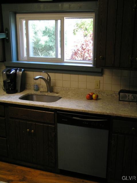 5810 Locust Valley Road Coopersburg, PA 18036 - Photo 4 of 23 a kitchen with a sink a window and cabinets