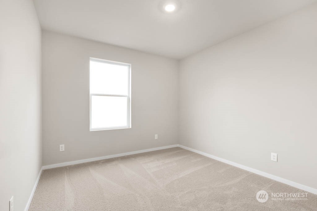 18937 Liberty Rdg Lane, Unit 955 Puyallup, WA 98374 - Photo 16 of 19 an empty room with a window