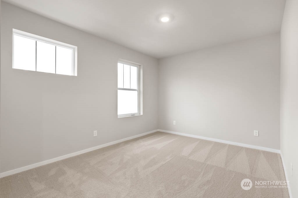 18937 Liberty Rdg Lane, Unit 955 Puyallup, WA 98374 - Photo 17 of 19 an empty room with windows