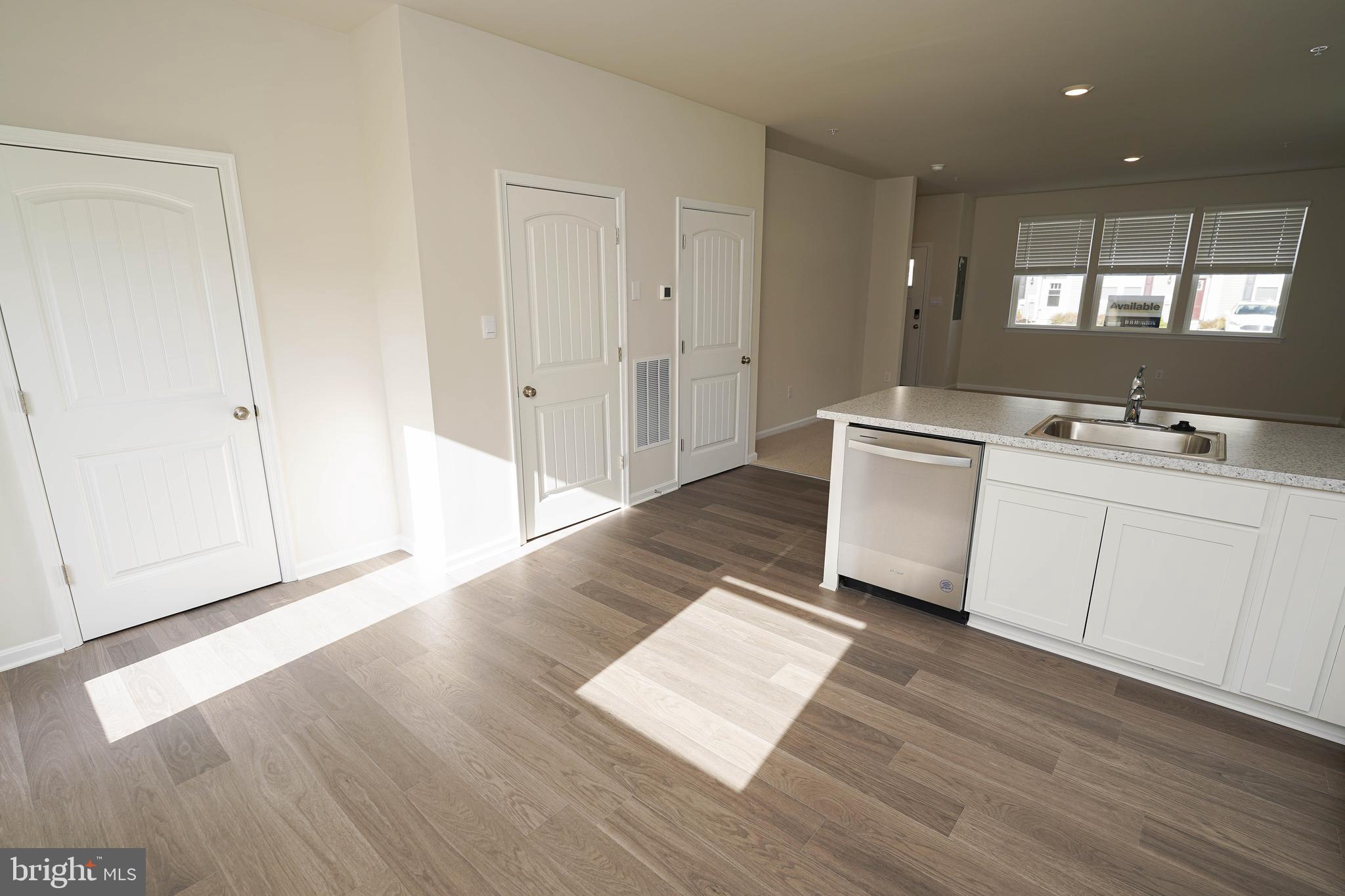 826 Derwent Lane Salisbury, MD 21801 - Photo 15 of 45 a room view with wooden floor and white doors
