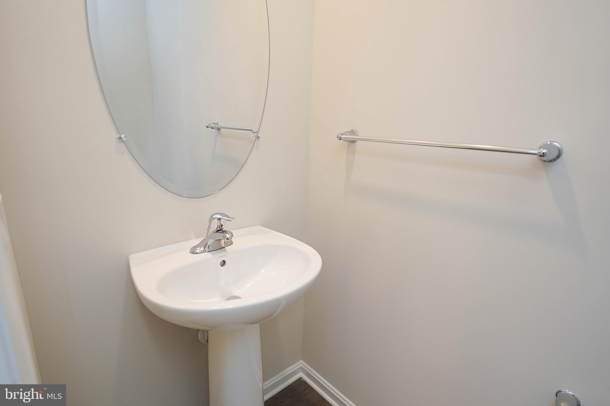 826 Derwent Lane Salisbury, MD 21801 - Photo 20 of 45 a bathroom with a sink and a mirror