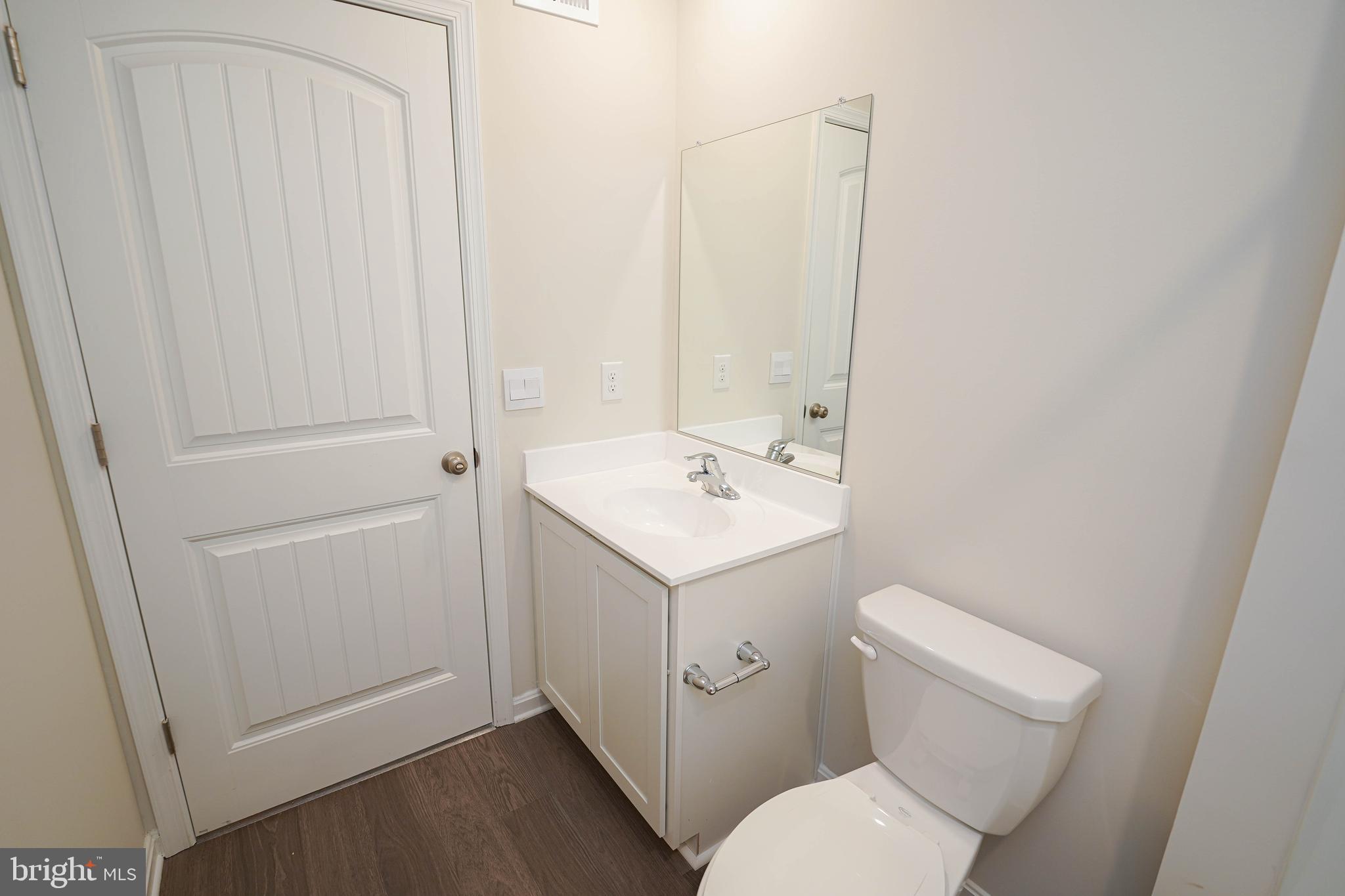 826 Derwent Lane Salisbury, MD 21801 - Photo 39 of 45 a bathroom with a toilet sink and mirror