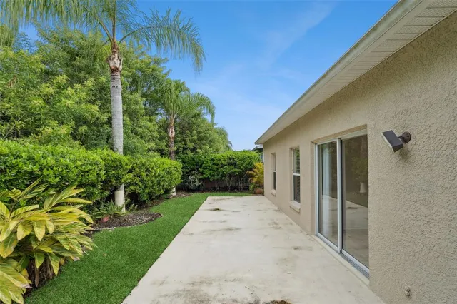 a view of a pathway both side of house