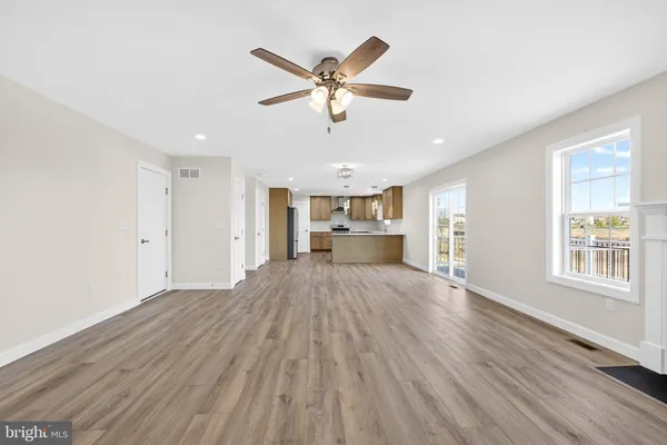 a kitchen with stainless steel appliances a refrigerator stove and sink
