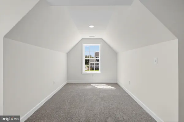 a view of an empty room and entryway
