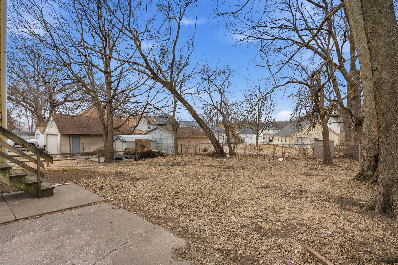 903 44th Street Rock Island, IL 61201 - Photo 25 of 28 a view of a yard covered with snow in front of house
