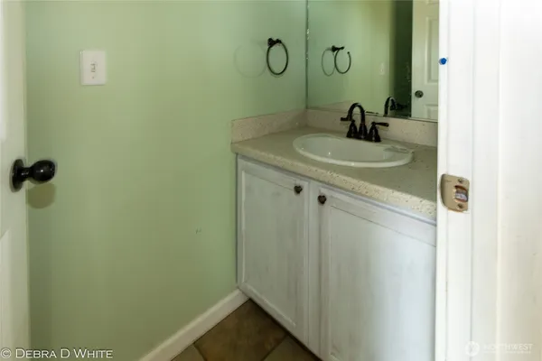 a bathroom with a sink and vanity