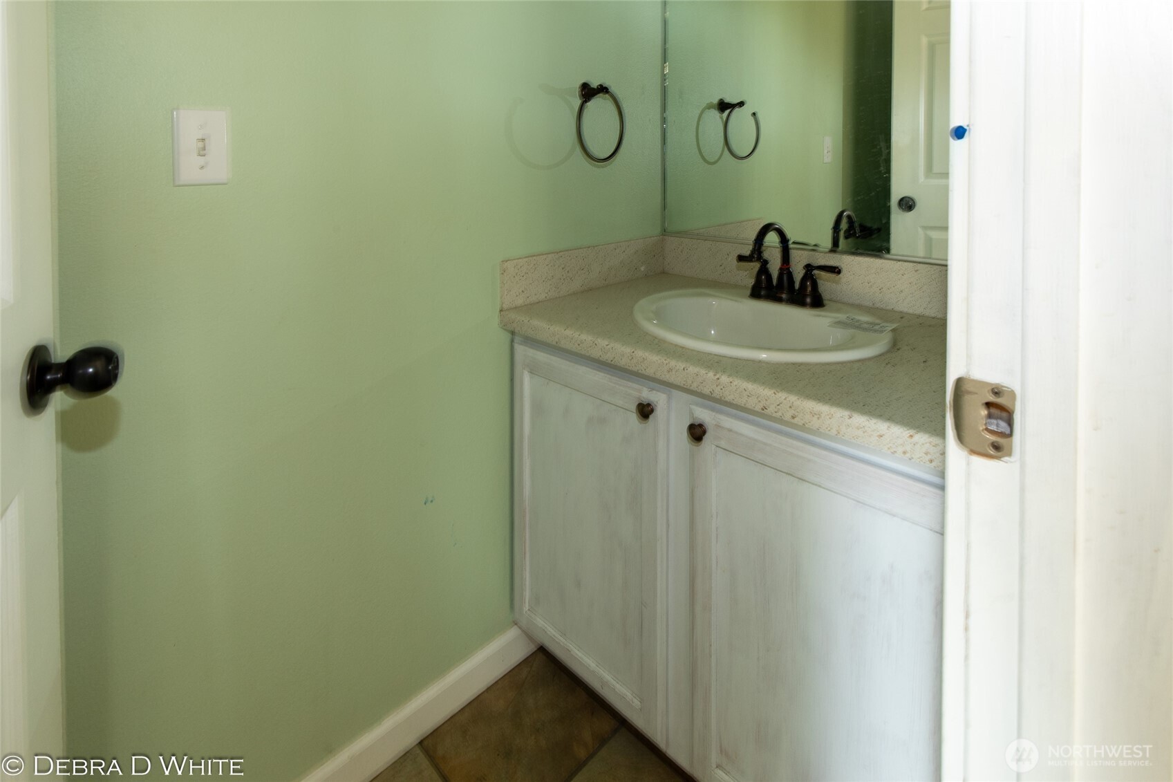 2 Kruse Street Omak, WA 98841 - Photo 13 of 23 a bathroom with a sink and vanity