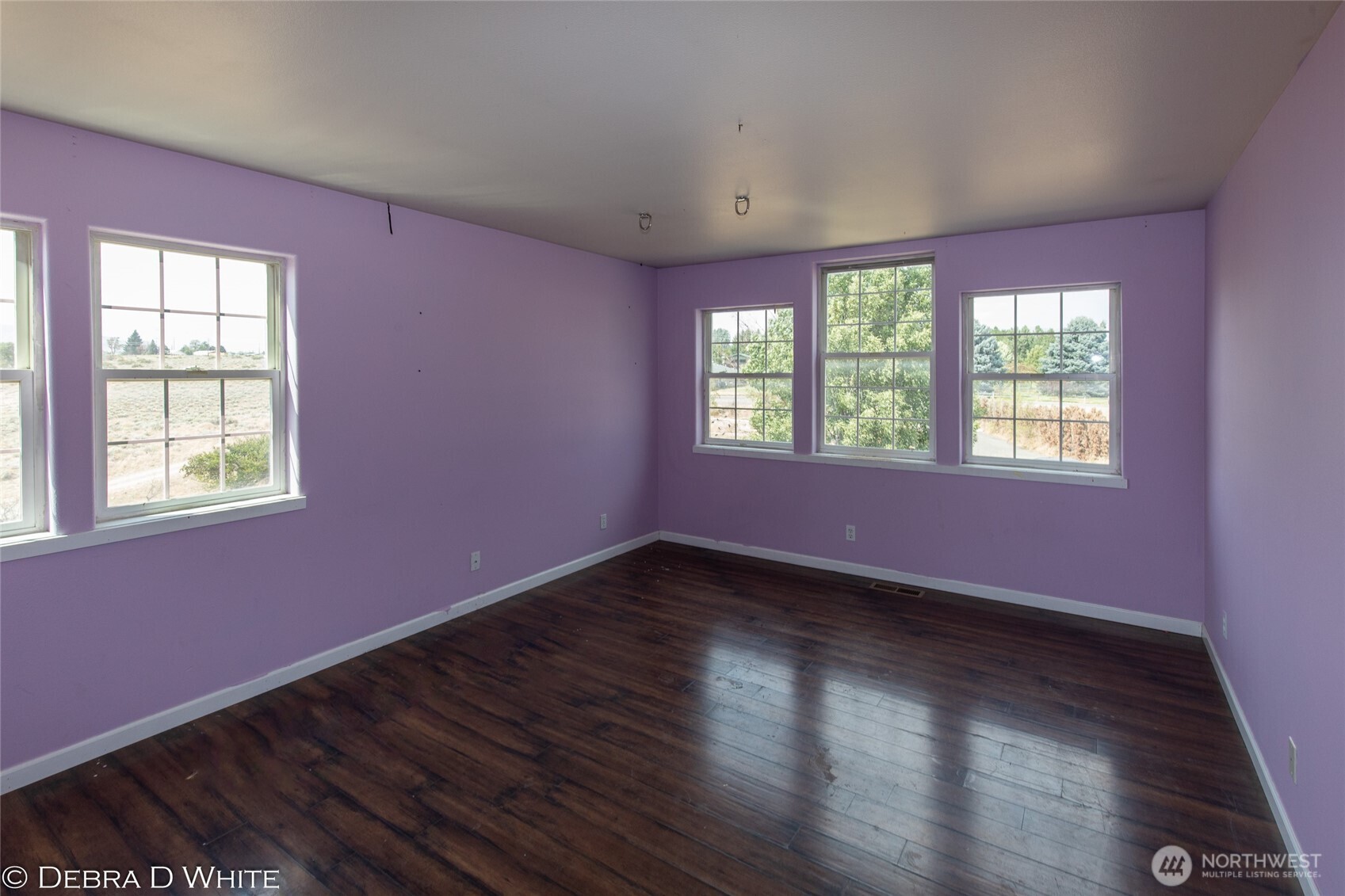 2 Kruse Street Omak, WA 98841 - Photo 15 of 23 a view of an empty room with wooden floor and a window