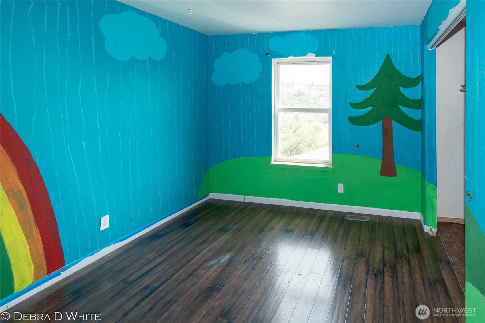 2 Kruse Street Omak, WA 98841 - Photo 19 of 23 a view of an empty room with wooden floor and a window