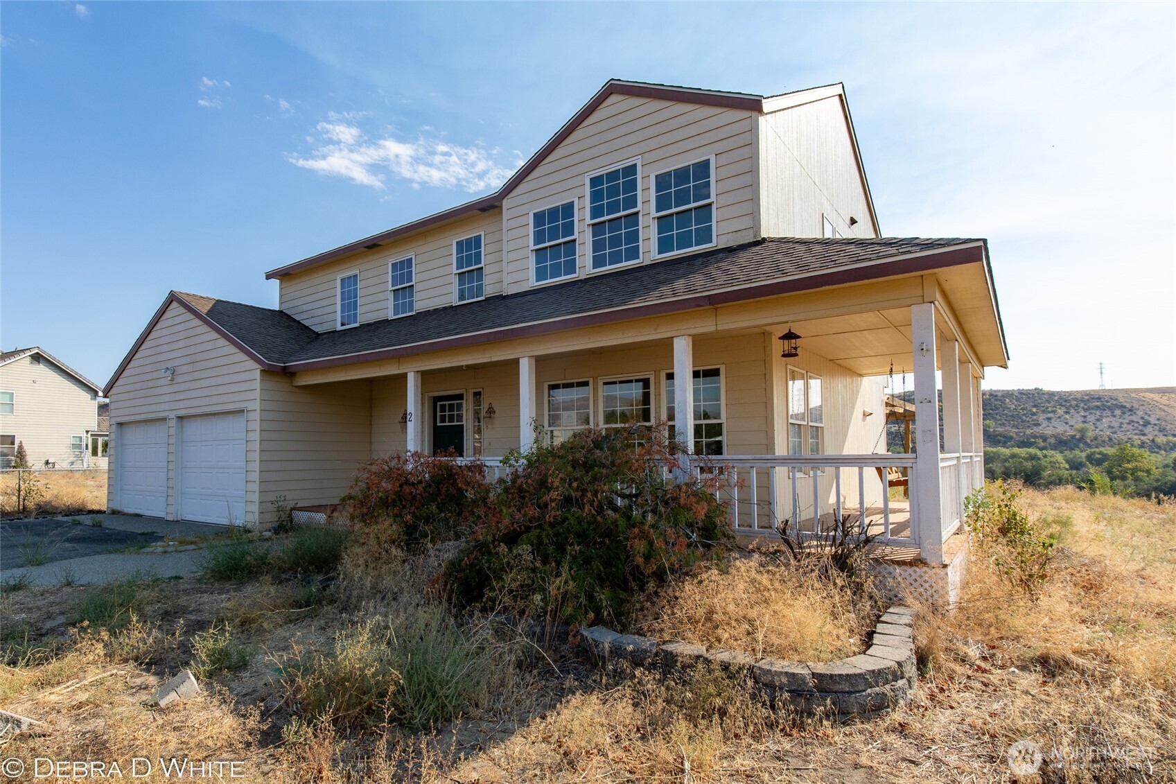 2 Kruse Street Omak, WA 98841 - Photo 2 of 23 a front view of house with yard and outdoor seating