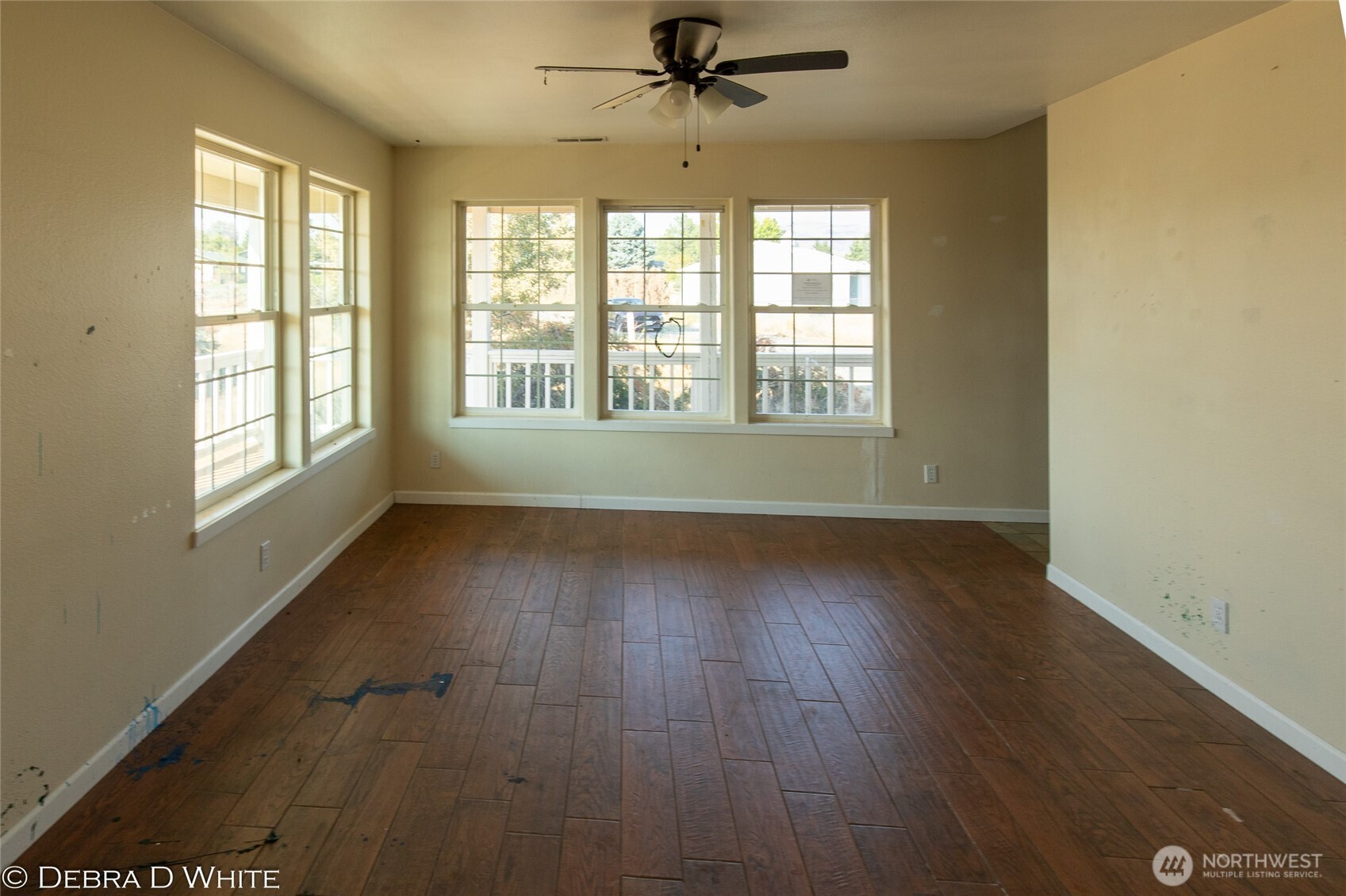 2 Kruse Street Omak, WA 98841 - Photo 6 of 23 a view of an empty room with wooden floor and a window