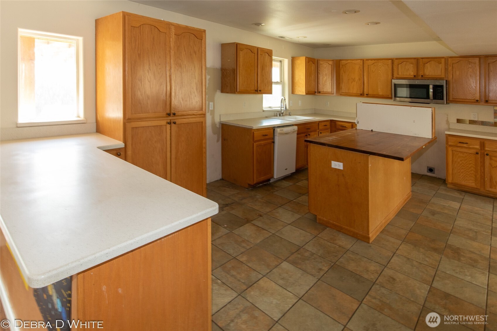 2 Kruse Street Omak, WA 98841 - Photo 10 of 23 a kitchen with stainless steel appliances granite countertop a sink counter space and cabinets