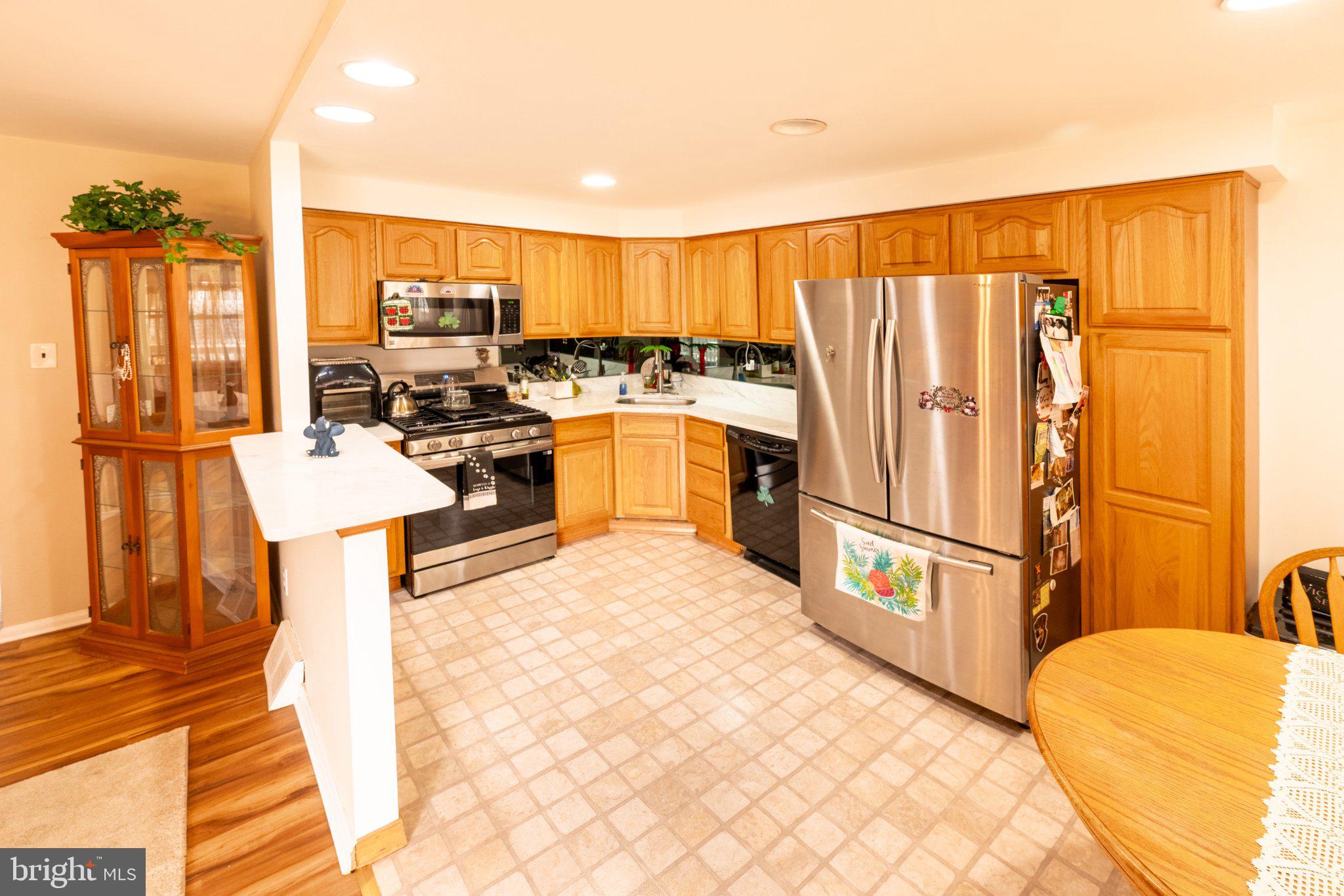12307 Dunks Ferry Road Philadelphia, PA 19154 - Photo 8 of 31 Inviting kitchen with warm wood tones.