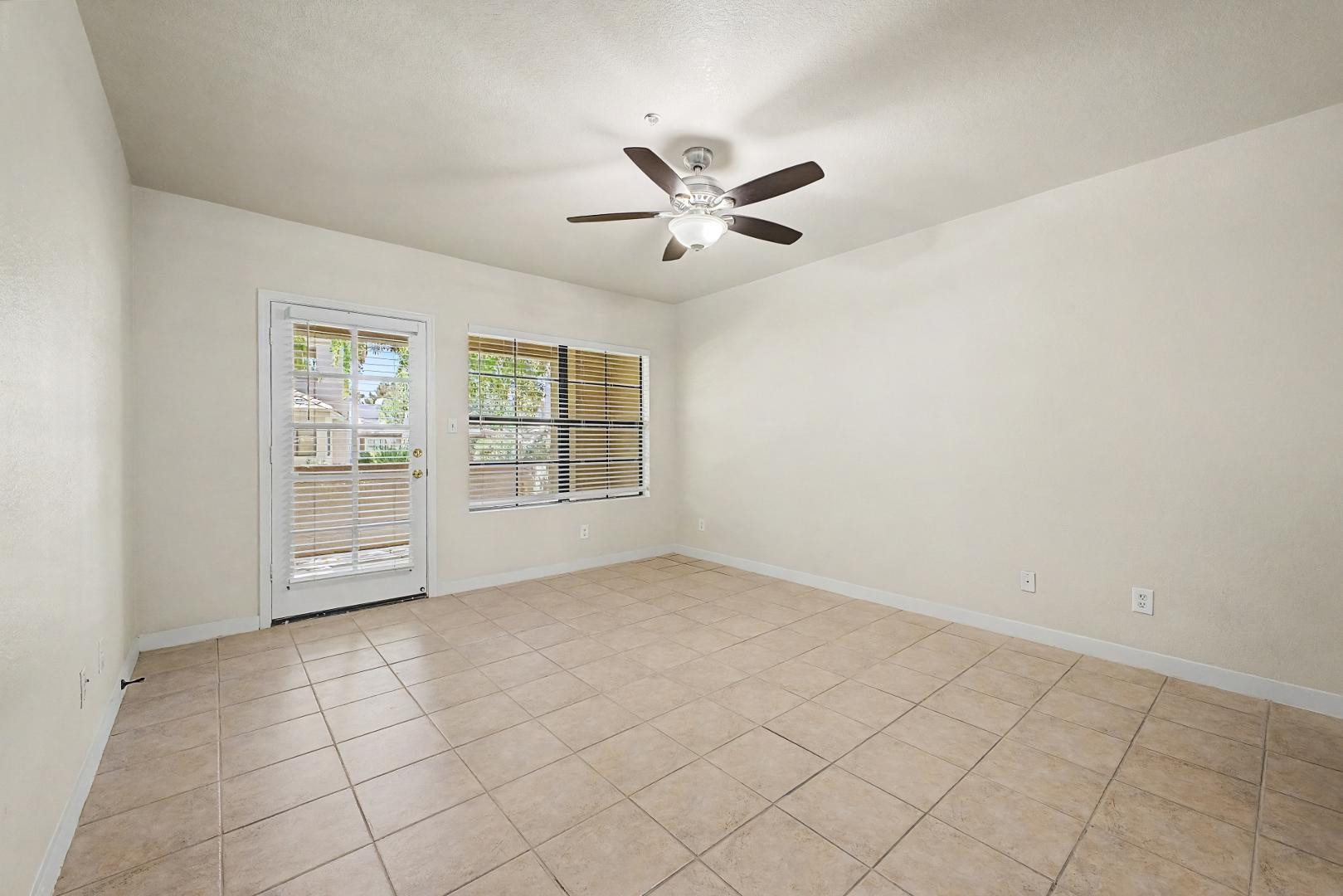 6885 East Cochise Road, Unit 142 Paradise Valley, AZ 85253 - Photo 10 of 47 an empty room with windows and fan