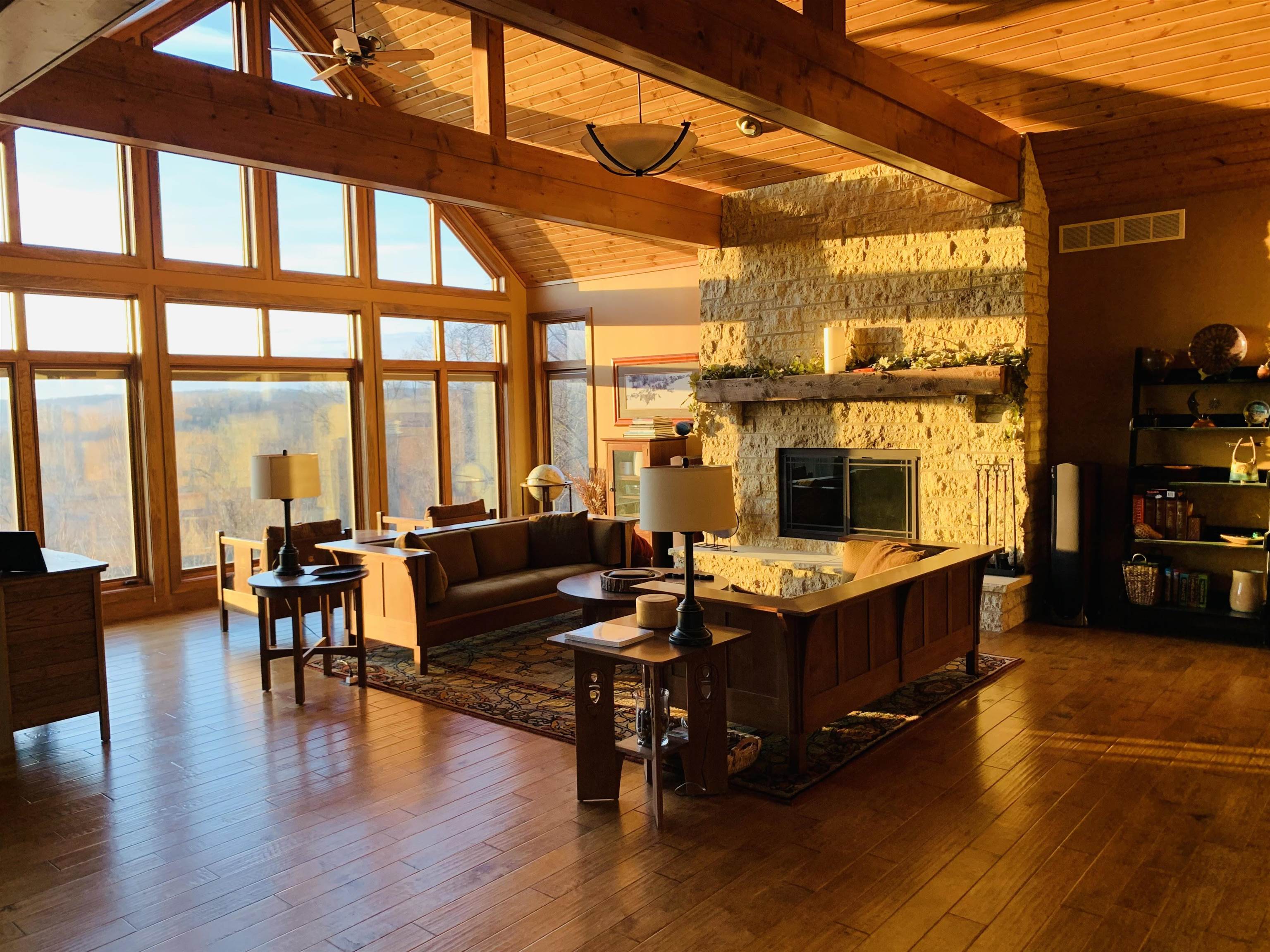 2592 East Liebert Road Elizabeth, IL 61028 - Photo 9 of 20 a living room with furniture a wooden floor and a table