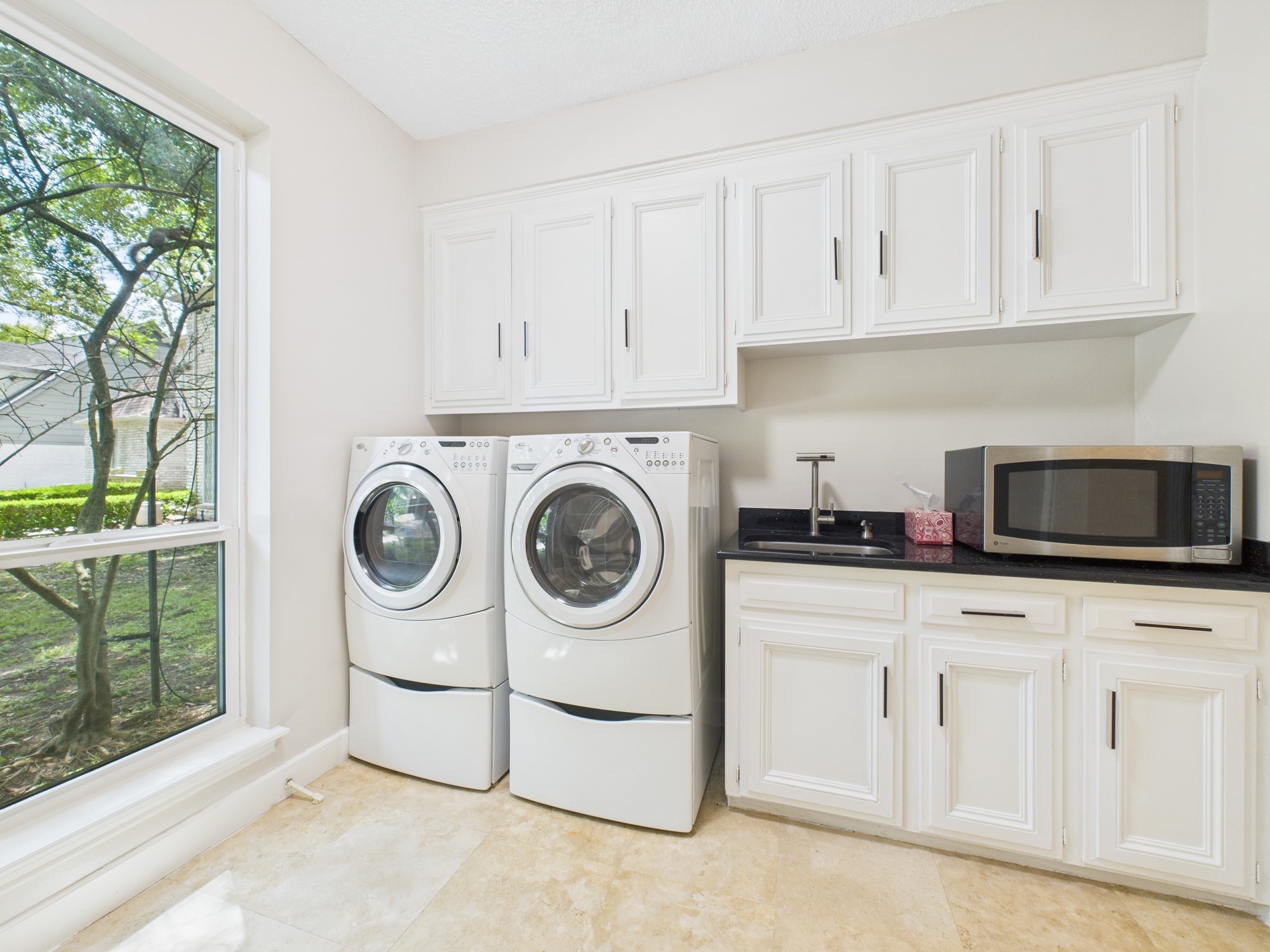 702 Daria Court Houston, TX 77079 - Photo 11 of 44 Functional Utility Room with Full Sized Units, Pedestals, Rinse Sink and Tons of Storage