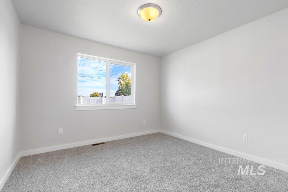 1340 Dawn Street Weiser, ID 83672 - Photo 25 of 32 Empty room featuring baseboards and carpet