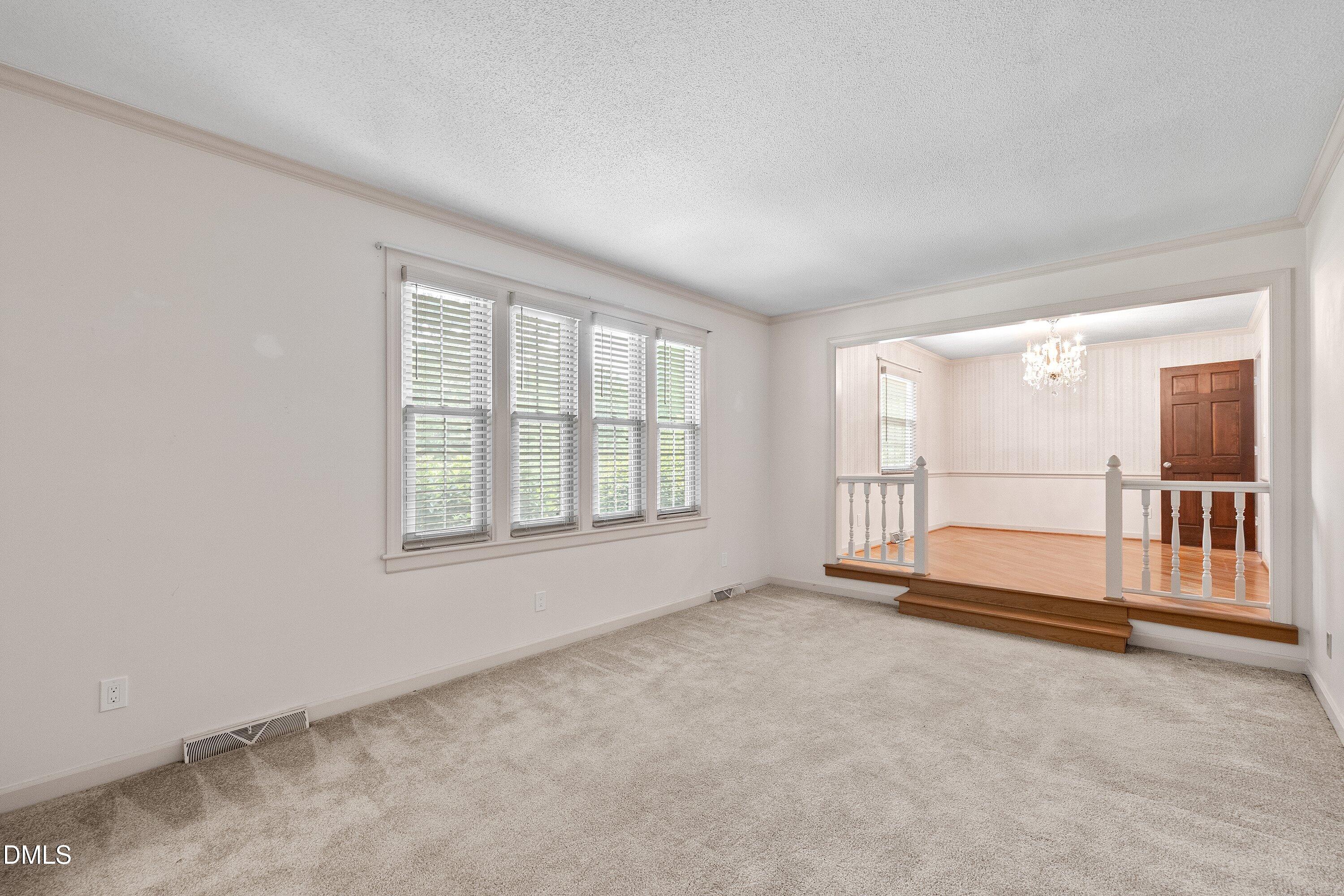 8133 Holly Forest Road Wake Forest, NC 27587 - Photo 19 of 50 an empty room with floor to ceiling windows
