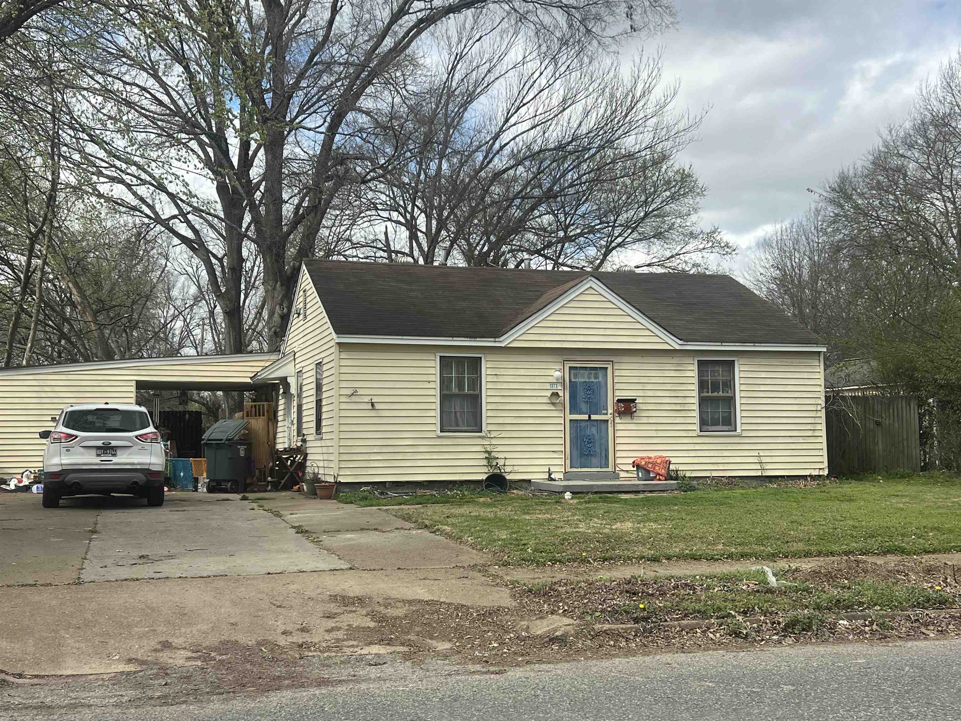 1373 Russwood Road Memphis, TN 38108 - Photo 1 of 2 a view of a house with a yard