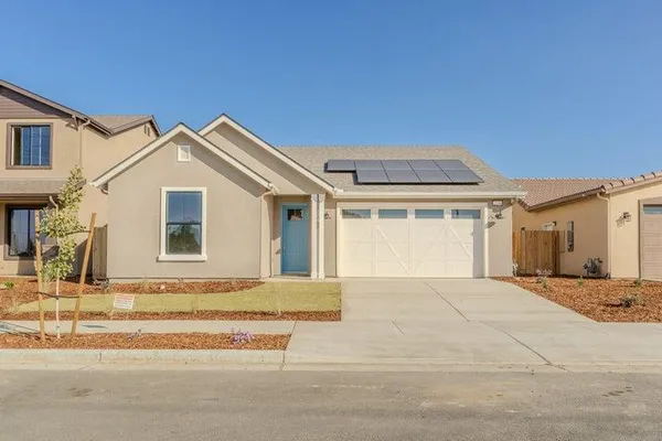 a front view of a house with a outdoor space