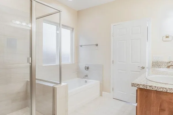 a bathroom with a bathtub and a sink