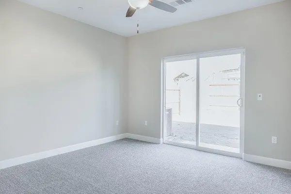 an empty room with closet area