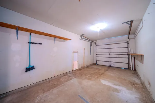 a view of a room with stairs and a fan