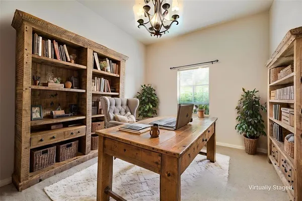 a view of a workspace with furniture