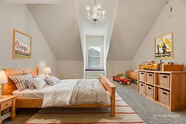 a bedroom with bed and window