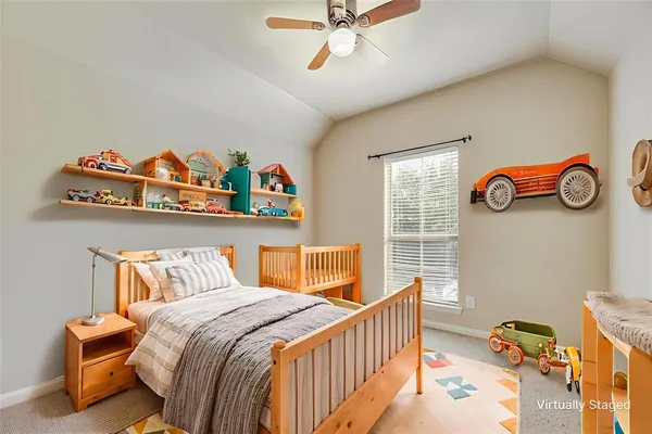 a bedroom with furniture and a window