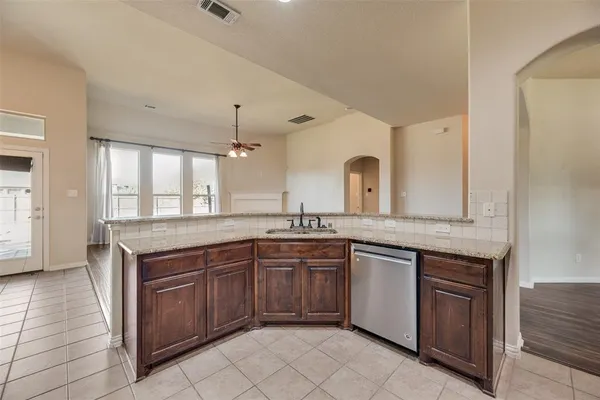 a kitchen with a sink and cabinets