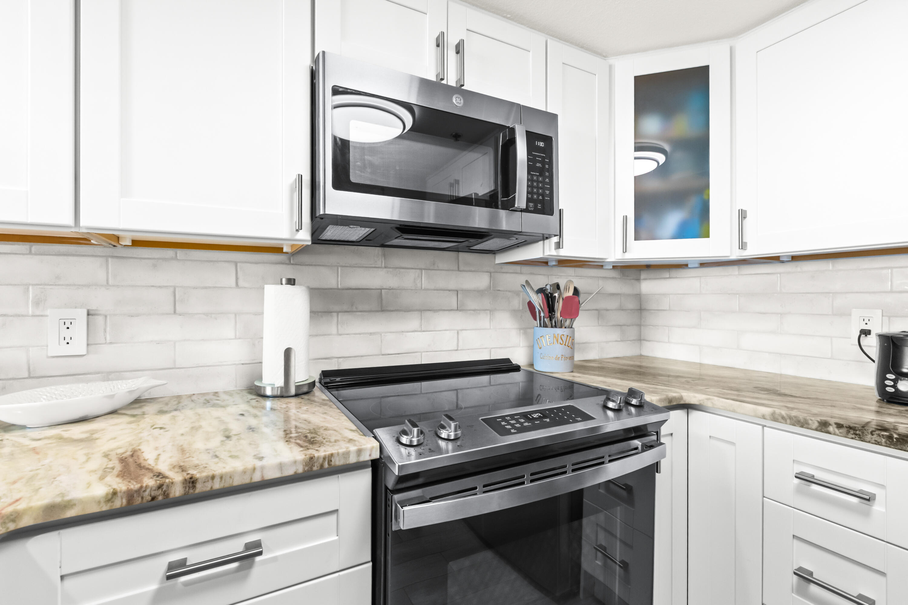 4100 East County Highway 30A, Unit 1604 Santa Rosa Beach, FL 32459 - Photo 11 of 43 a kitchen with granite countertop a stove and a microwave