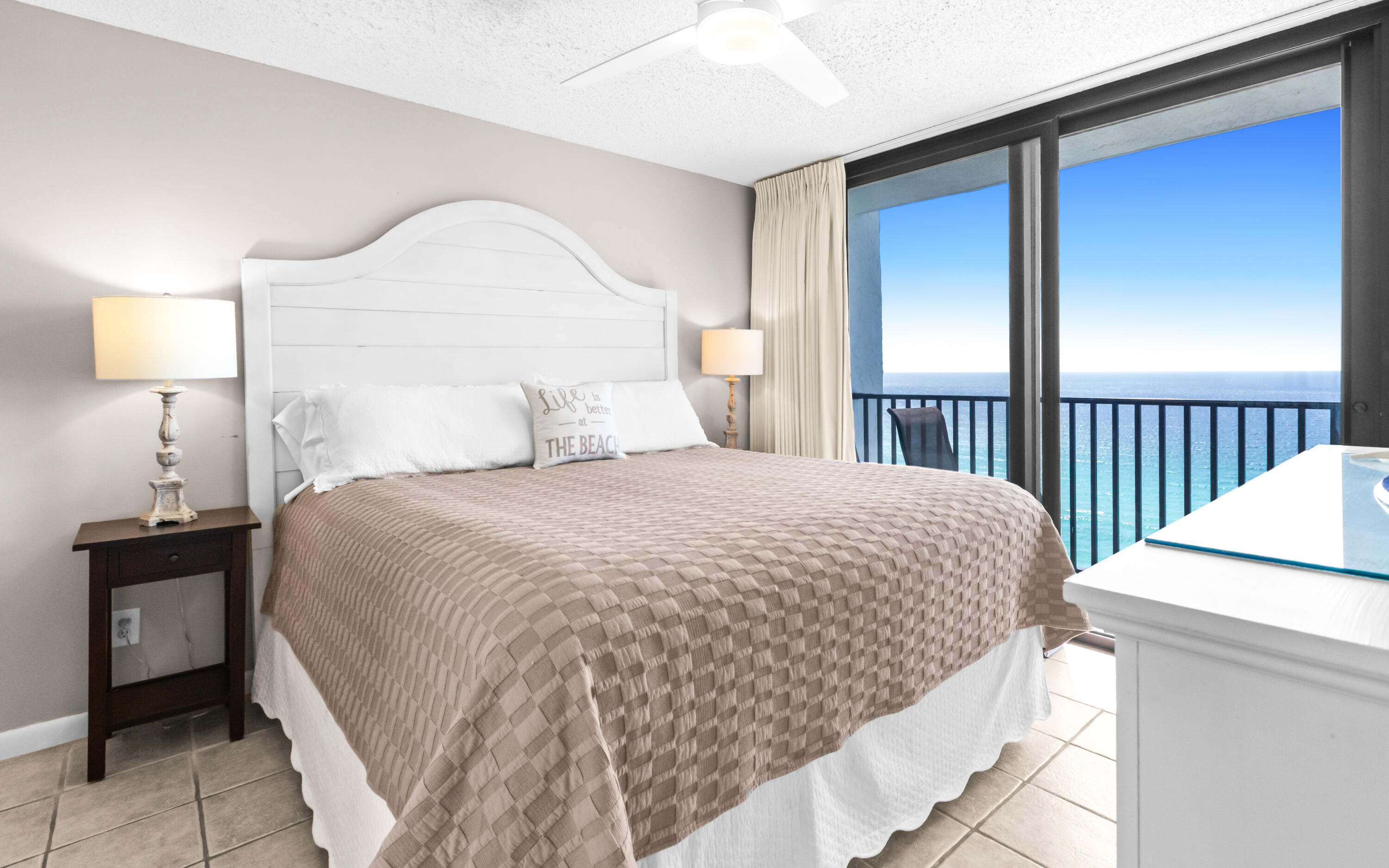 4100 East County Highway 30A, Unit 1604 Santa Rosa Beach, FL 32459 - Photo 20 of 43 a bedroom with a bed and a lamp